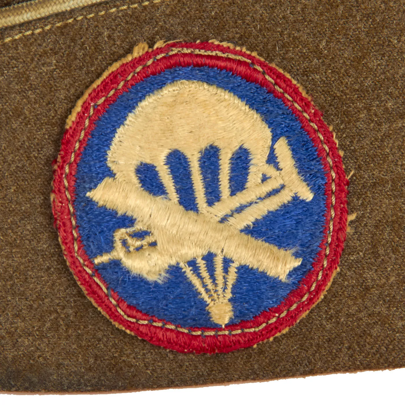 Original U.S. WWII Named 82nd Airborne Uniform Grouping Featuring Custom Camouflage Parachute Silk Lined Overseas Cap - With Documents